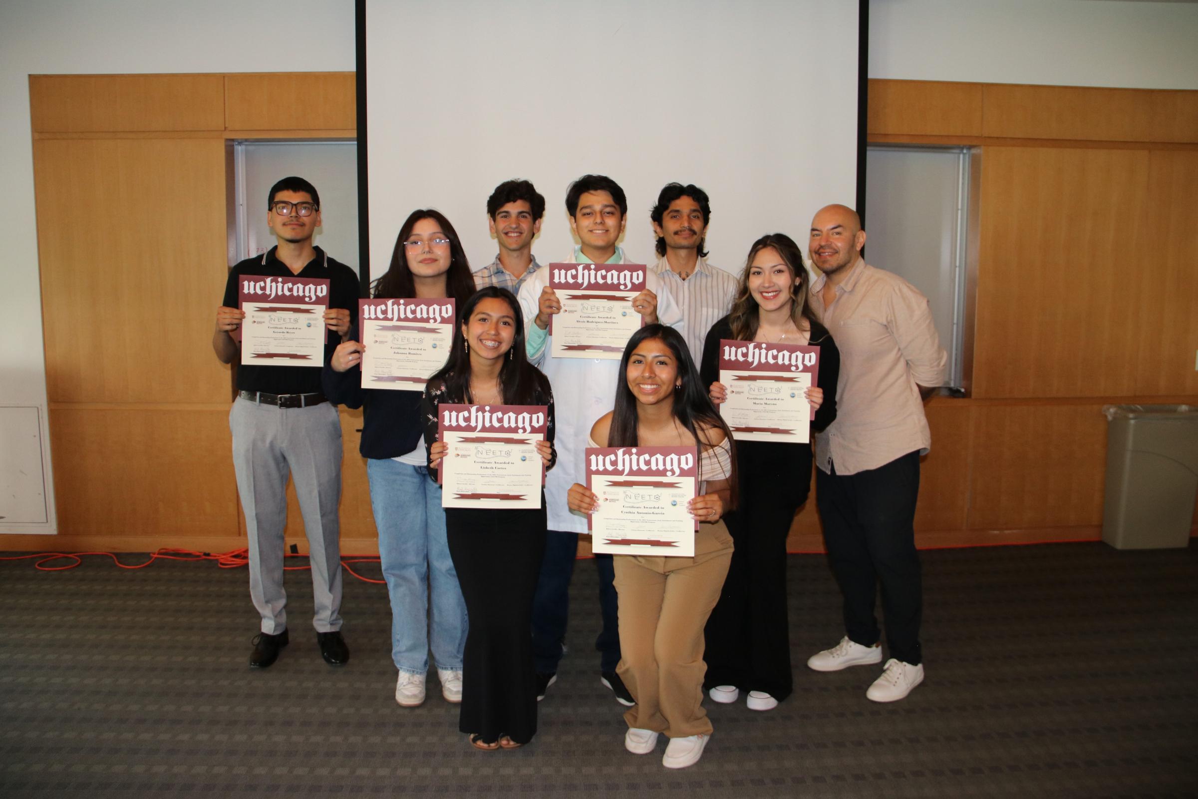 Students show their certificates