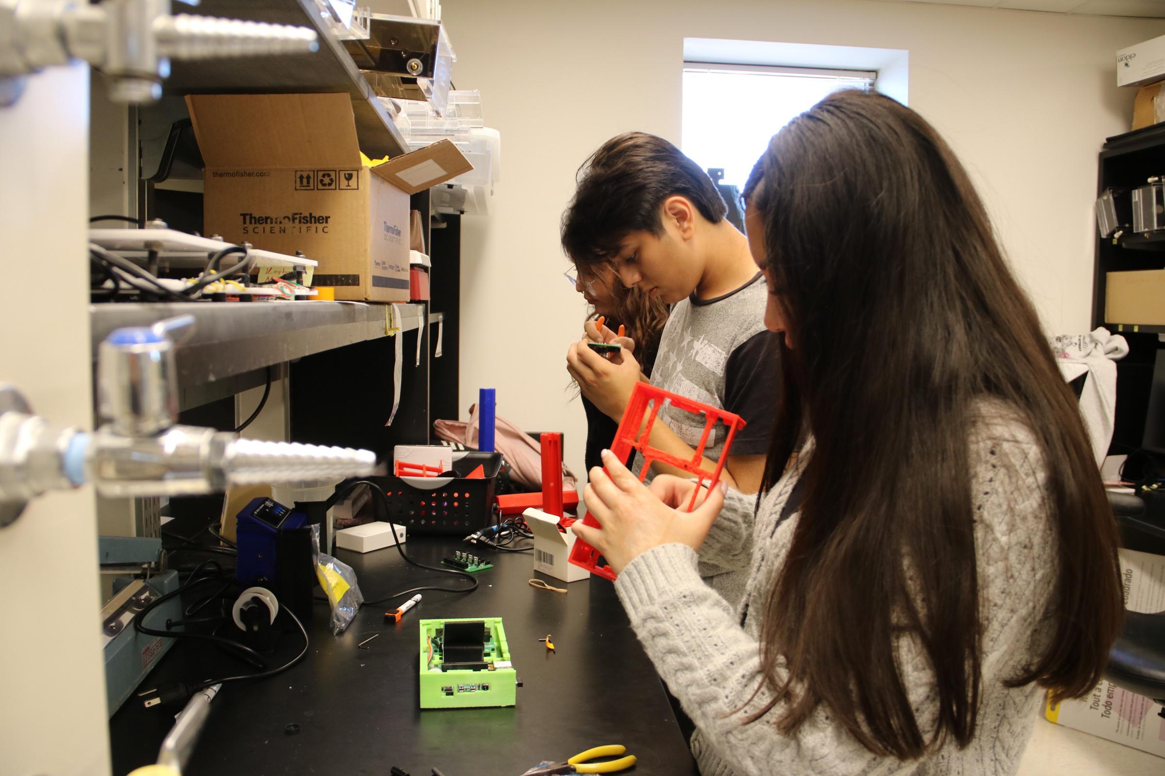 Student building a 3D object