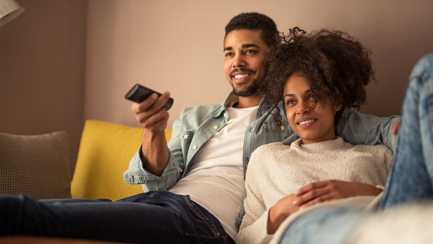 People sitting together on the couch