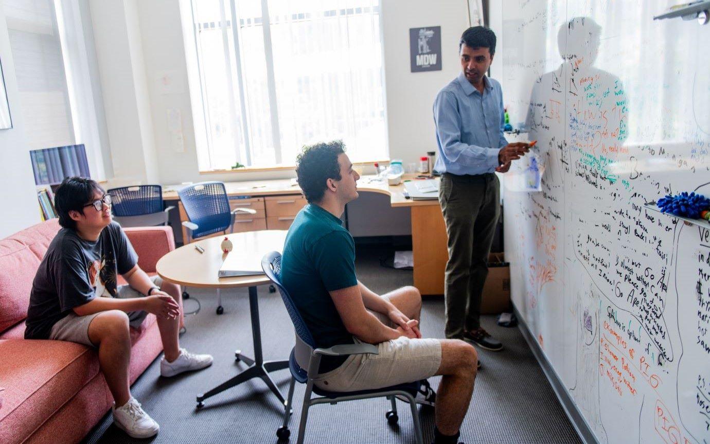 Students watch professor lecture