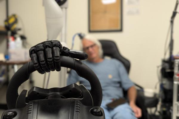 bionic hand on steering wheel